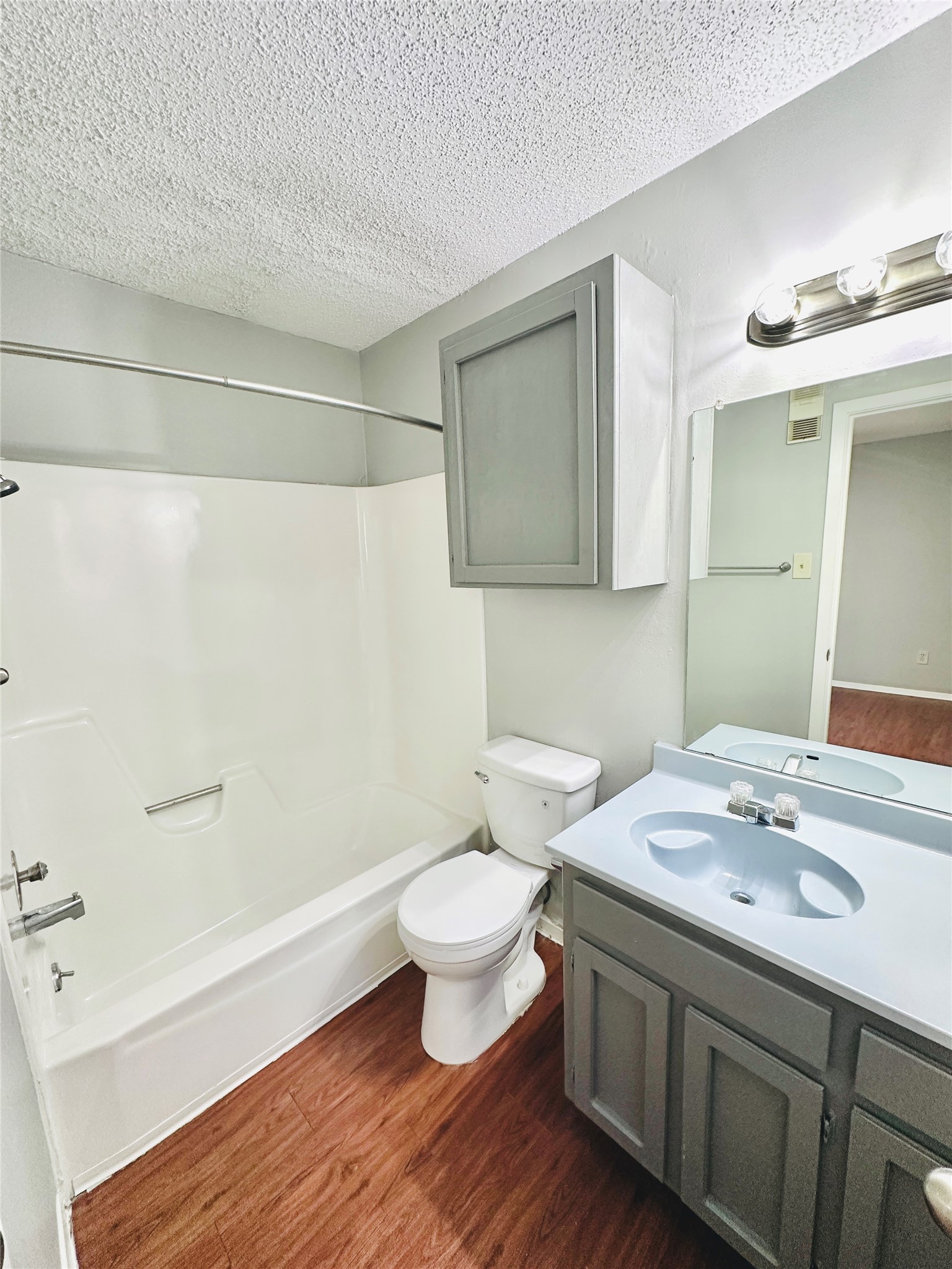 3702 South 2nd Street, Unit 107 Austin, TX 78704 - Photo 12 of 12 a bathroom with a sink toilet and shower