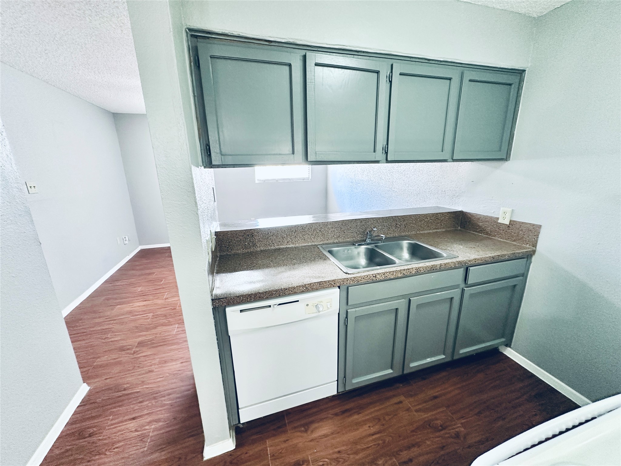 3702 South 2nd Street, Unit 107 Austin, TX 78704 - Photo 2 of 12 a kitchen with a sink and cabinets