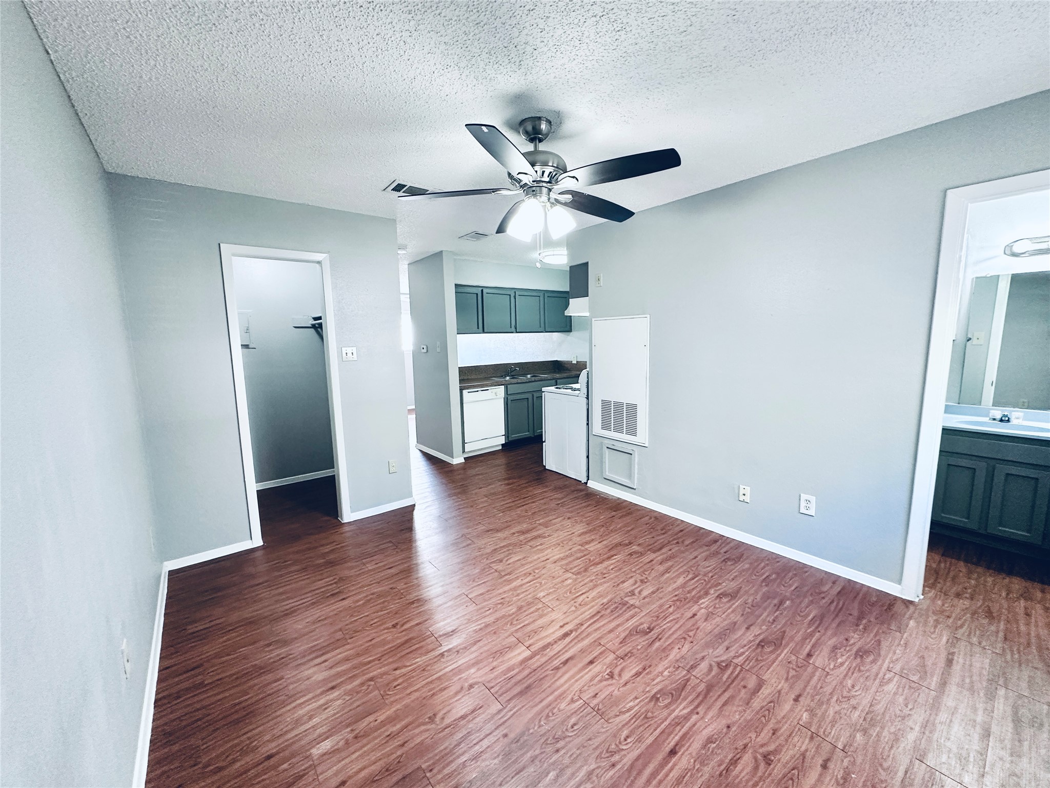 3702 South 2nd Street, Unit 107 Austin, TX 78704 - Photo 9 of 12 a view of an empty room with window and wooden floor