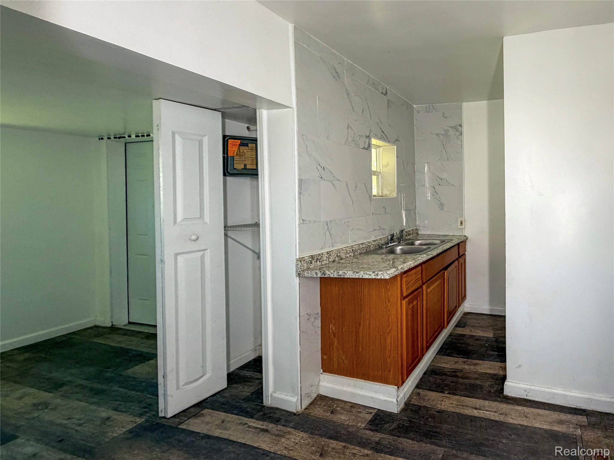 48 Florence Street River Rouge, MI 48218 - Photo 10 of 11 Bathroom with vanity and dark wood-style flooring