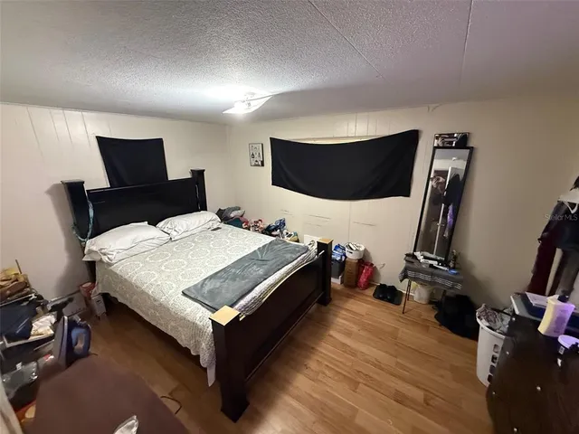 a room with gym equipment and a flat screen tv