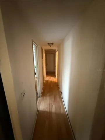 a living room with furniture flowerpot and window
