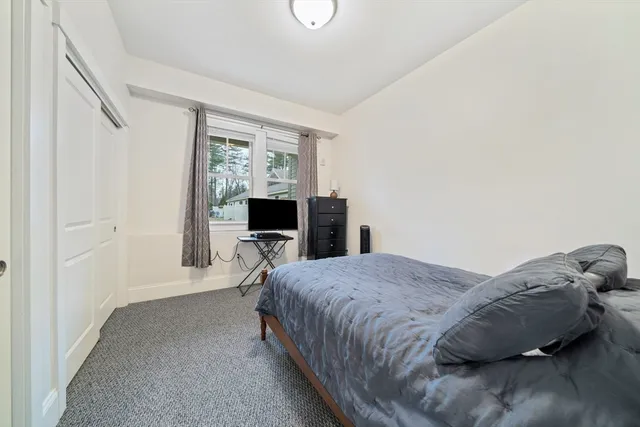 a bathroom with a shower toilet and sink