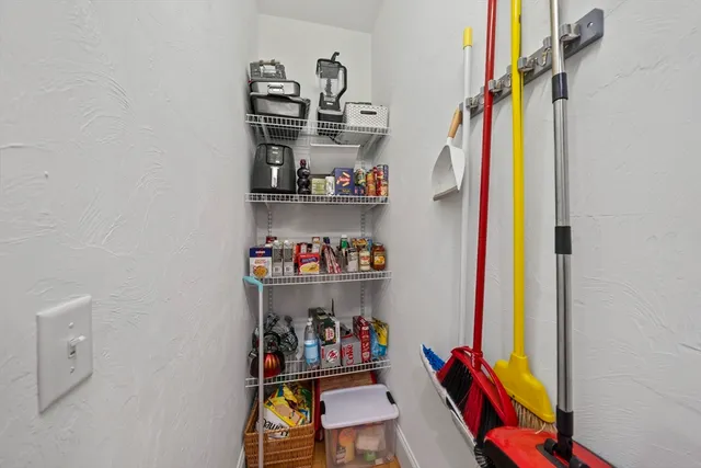 a view of a patio with a table and chairs