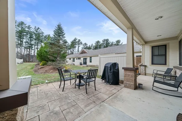 a view of a house with backyard porch and sitting area