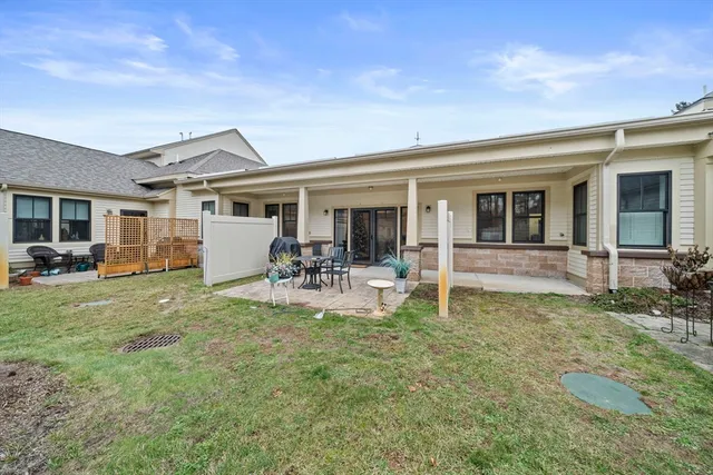 a balcony with table and chairs