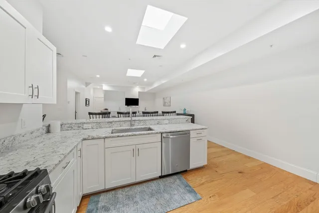 a kitchen with a stove microwave and refrigerator