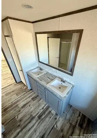 a bathroom with a sink and a mirror
