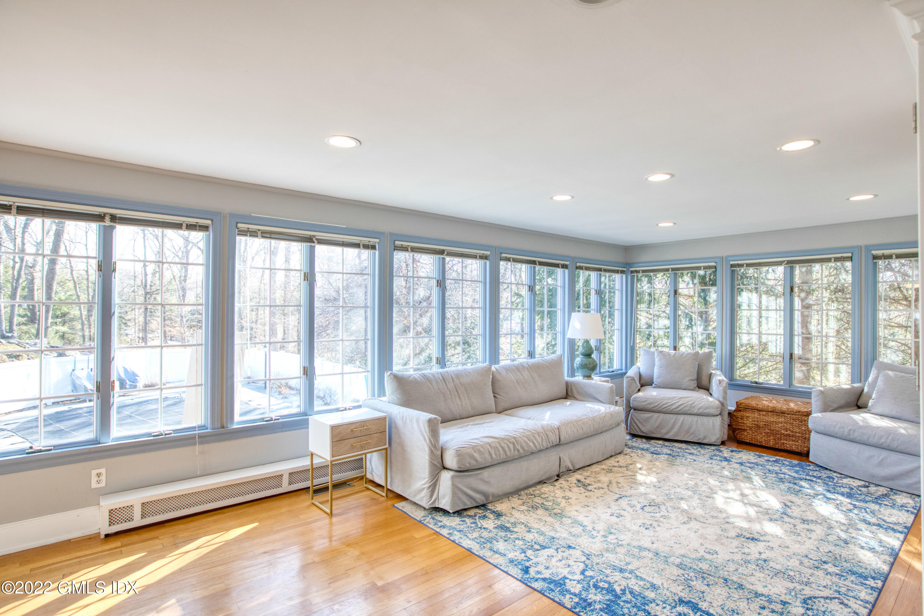 22 Indian Mill Road Cos Cob, CT 06807 - Photo 10 of 24 a living room with furniture and a large window