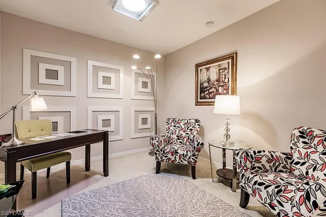 a bedroom with furniture and a flat screen tv