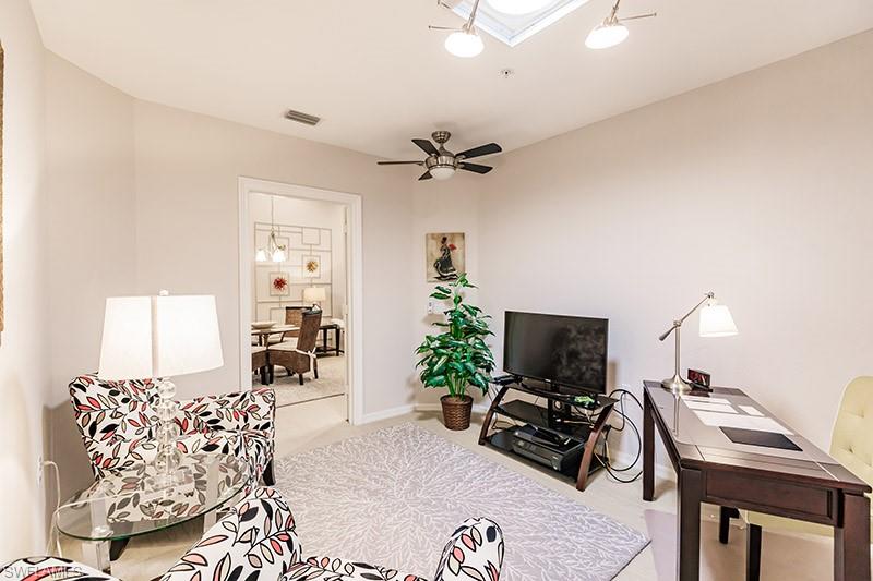 8135 Celeste Drive, Unit 4218 Naples, FL 34113 - Photo 19 of 37 a workspace with furniture and a potted plant