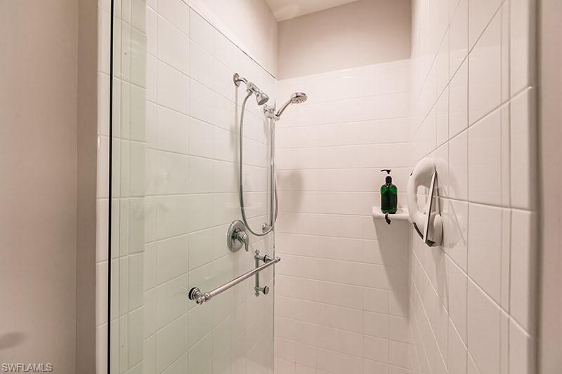 8135 Celeste Drive, Unit 4218 Naples, FL 34113 - Photo 25 of 37 a bathroom with a shower