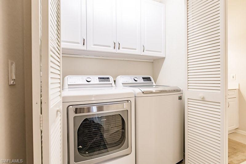 8135 Celeste Drive, Unit 4218 Naples, FL 34113 - Photo 35 of 37 a utility room with dryer and washer
