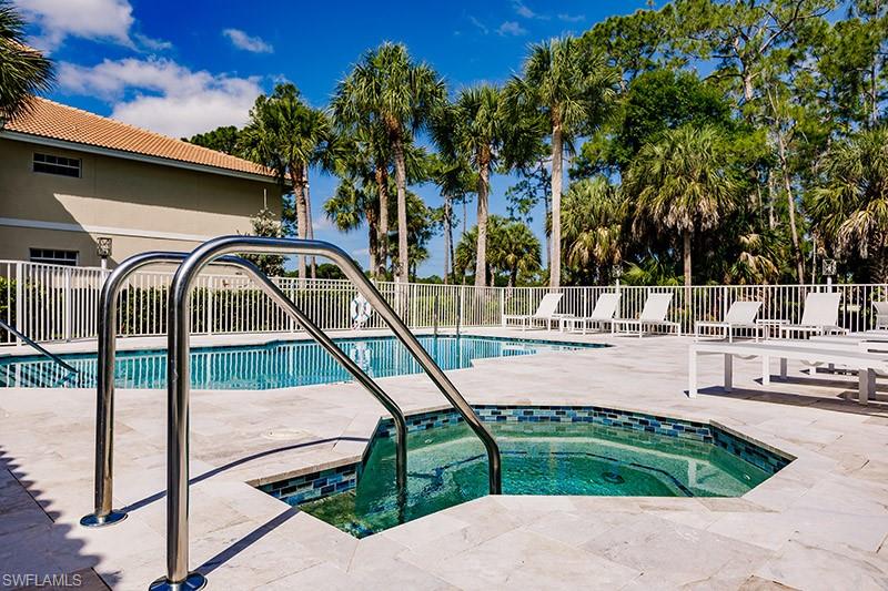 8135 Celeste Drive, Unit 4218 Naples, FL 34113 - Photo 37 of 37 a view of backyard with swimming pool and seating space
