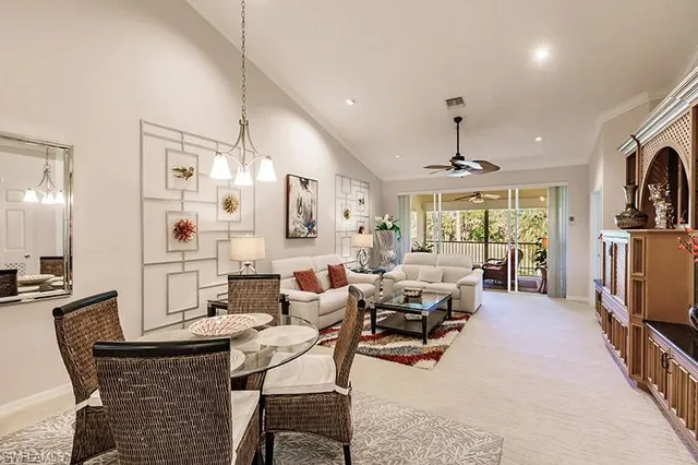 a living room with fireplace furniture and a flat screen tv