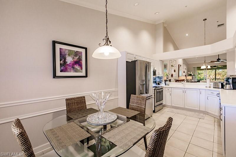 8135 Celeste Drive, Unit 4218 Naples, FL 34113 - Photo 10 of 37 a living room with furniture and kitchen view