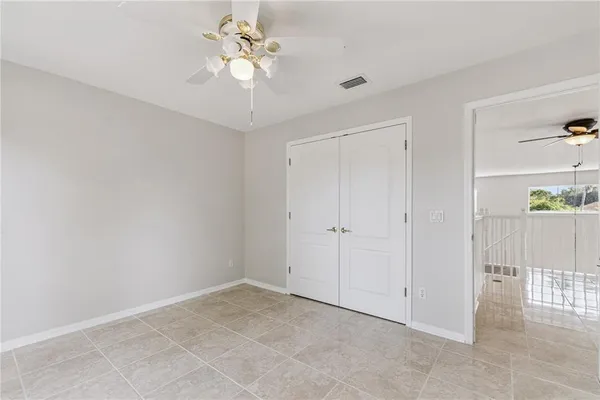 a view of an empty room with windows