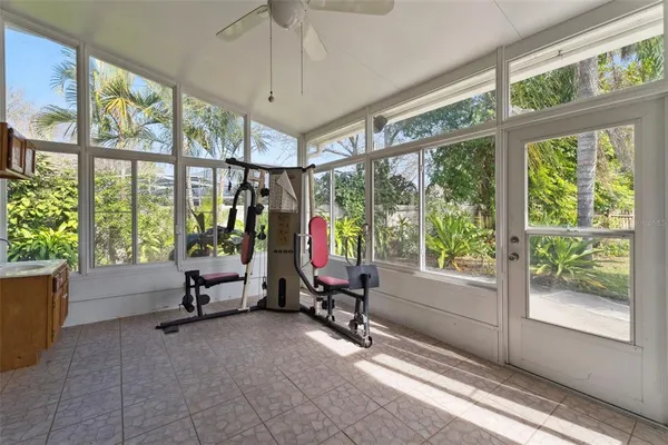 a view of a livingroom with furniture and floor to ceiling window