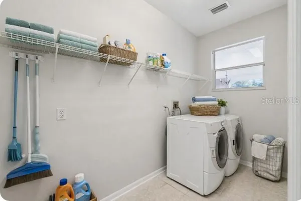 a utility room with dryer and washer