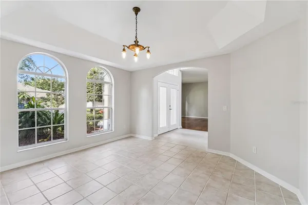a view of a dining room with furniture window and outside view