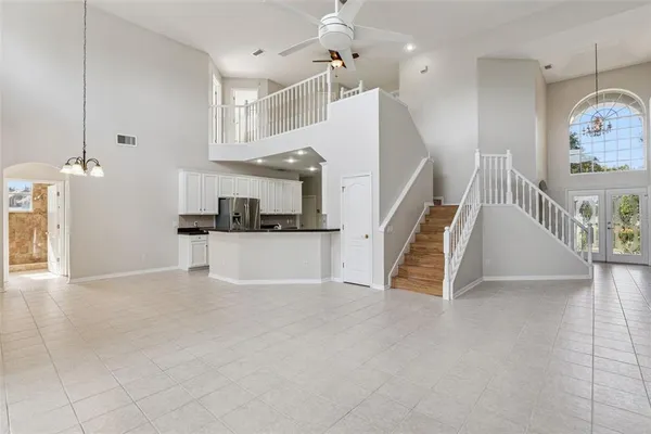 a view of a livingroom with furniture and stairs