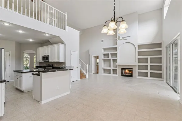a kitchen with stainless steel appliances granite countertop a stove and cabinets