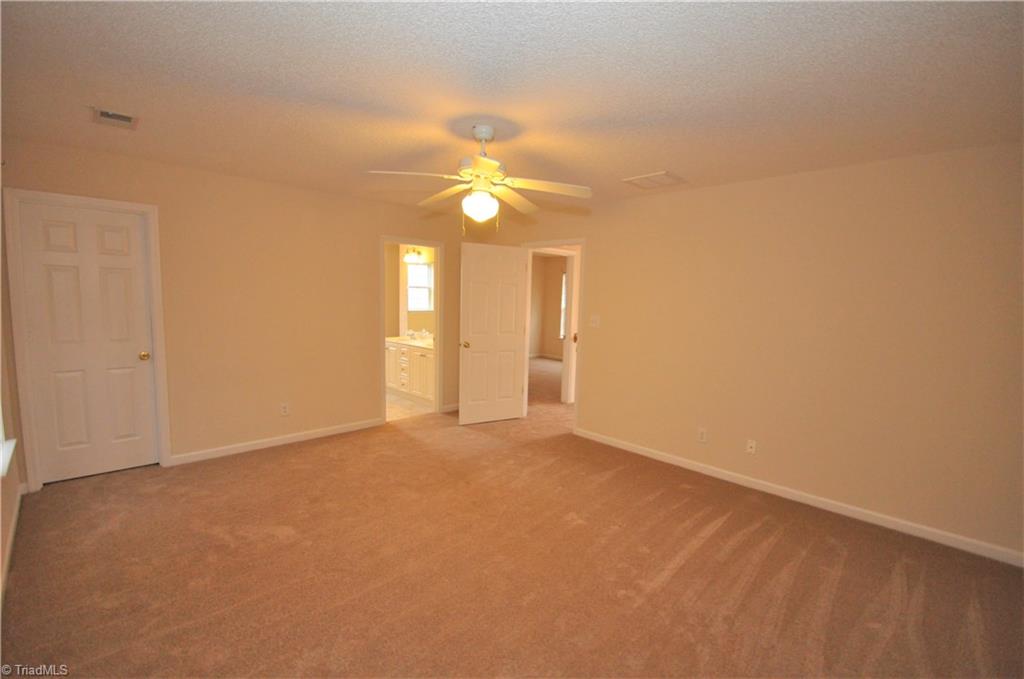 791 Pecan Ridge Circle Kernersville, NC 27284 - Photo 16 of 28 Master bedroom with walk-in closet and bath