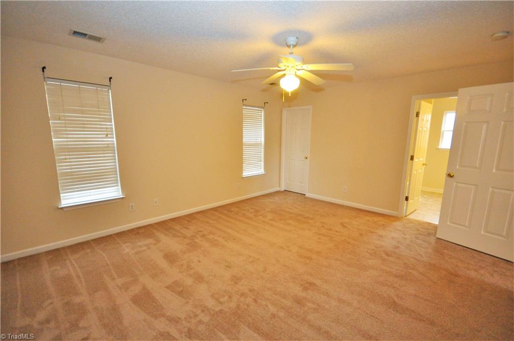 791 Pecan Ridge Circle Kernersville, NC 27284 - Photo 17 of 28 Master bedroom with walk-in closet and bath