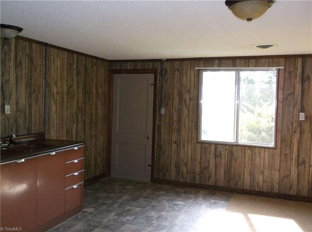 1957 Wright Road Lexington, NC 27292 - Photo 11 of 18 Large room with kitchen area/dining area - also room for more den or office area.