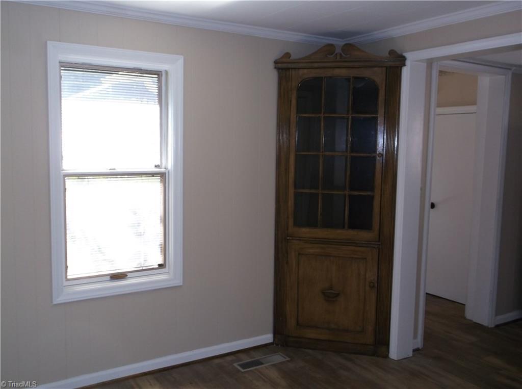 1957 Wright Road Lexington, NC 27292 - Photo 5 of 18 Dining room has built in corner cabinet. New flooring!