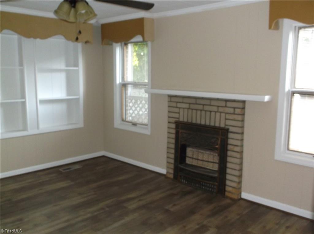 1957 Wright Road Lexington, NC 27292 - Photo 9 of 18 Living room has new floor - gas fireplace in addition to central heat and air.