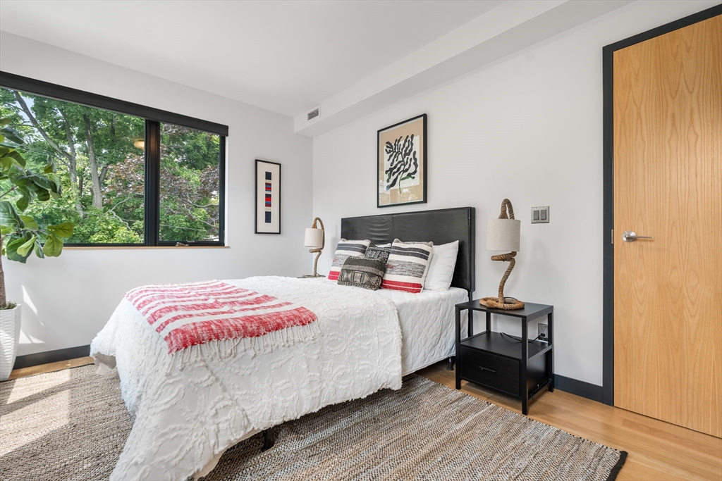 20 Madison Street Cambridge, MA 02138 - Photo 14 of 37 a bedroom with a bed and a window