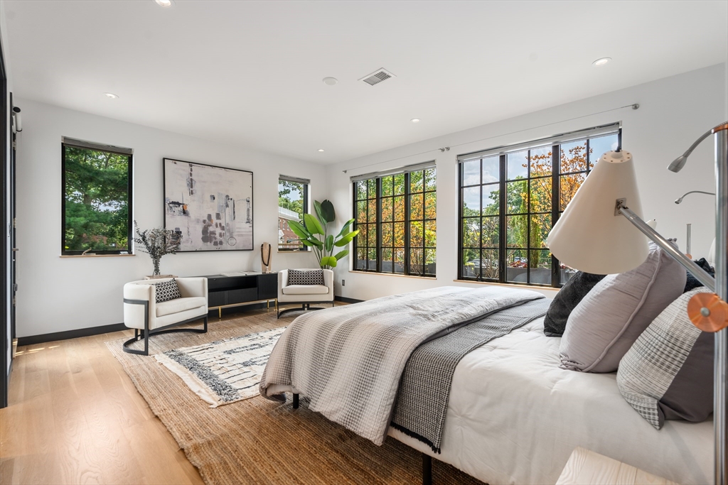 20 Madison Street Cambridge, MA 02138 - Photo 18 of 37 a bedroom with a bed and a large window