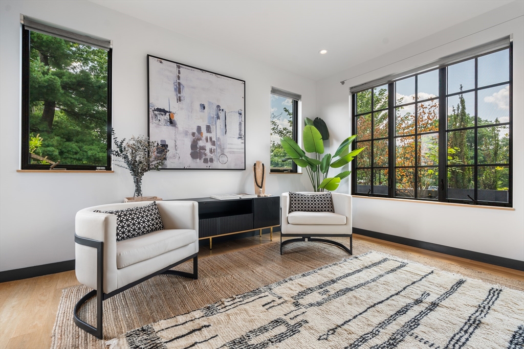 20 Madison Street Cambridge, MA 02138 - Photo 20 of 37 a living room with furniture and a large window