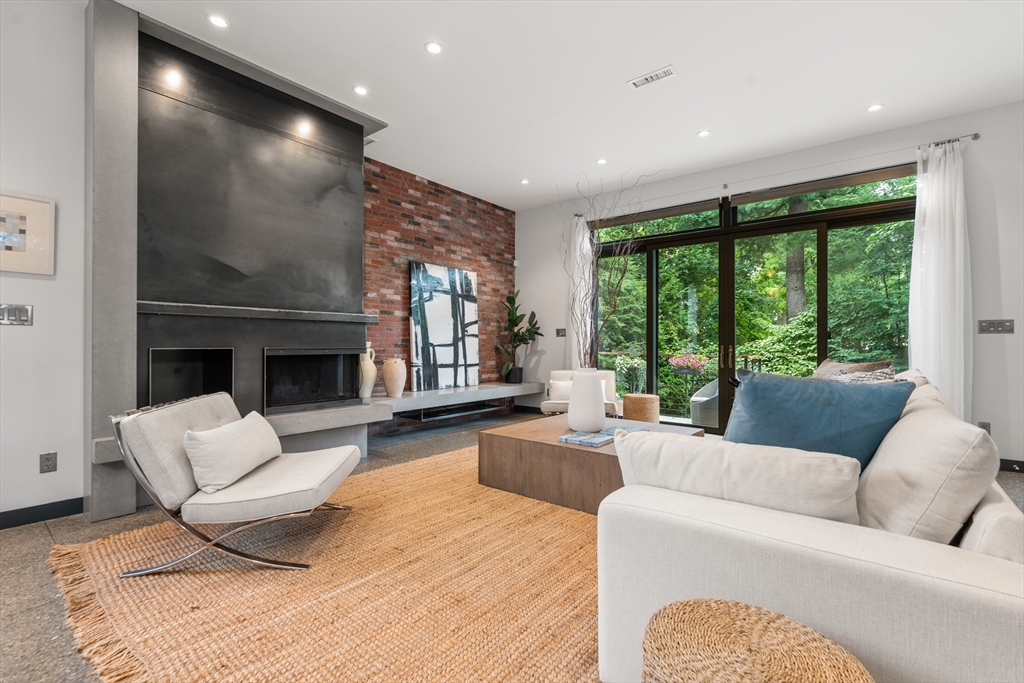20 Madison Street Cambridge, MA 02138 - Photo 3 of 37 a living room with furniture and a fireplace
