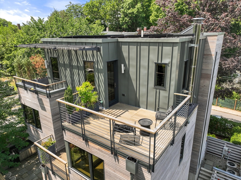20 Madison Street Cambridge, MA 02138 - Photo 35 of 37 a view of deck with furniture and trees