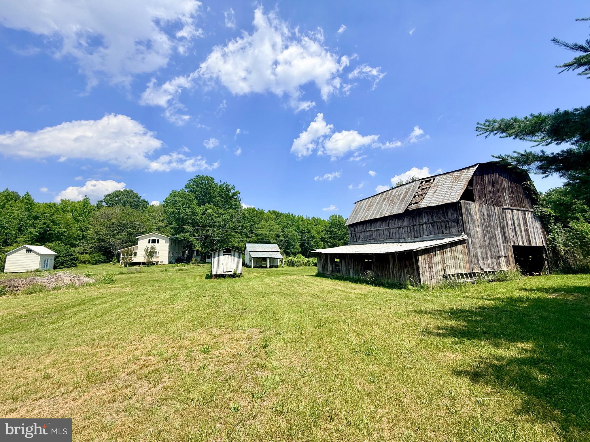 1311 Borden Road Bumpass, VA 23024 - Photo 60 of 68 Barn and additional outbuildings And back of home