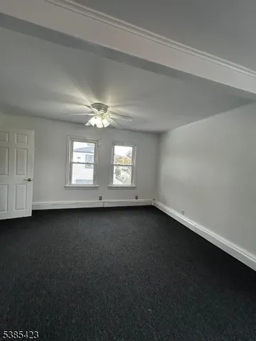 a view of a room that has a large window