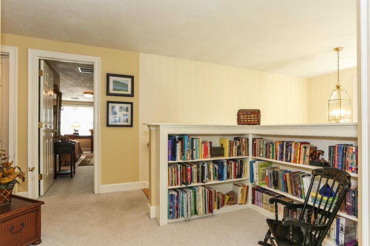218 Little River Road Cotuit, MA 02635 - Photo 25 of 30 a view of a livingroom with a bookshelf