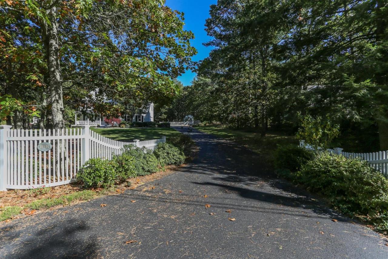 218 Little River Road Cotuit, MA 02635 - Photo 29 of 30 a backyard of a house with lots of green space