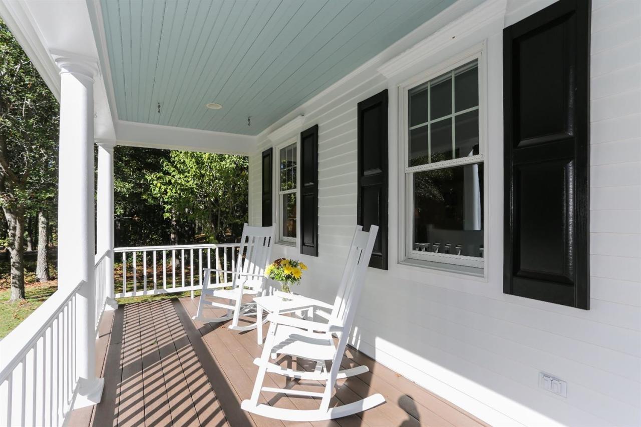 218 Little River Road Cotuit, MA 02635 - Photo 3 of 30 a view of a chair and tables in the balcony