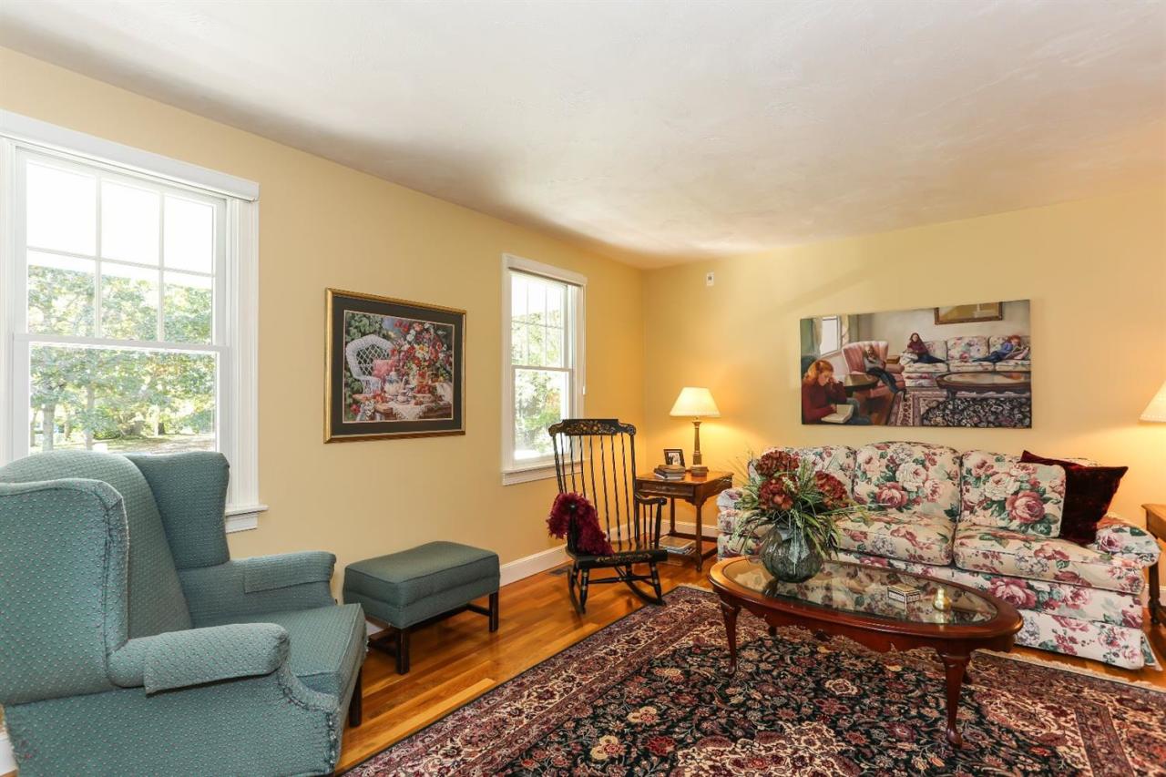 218 Little River Road Cotuit, MA 02635 - Photo 8 of 30 a living room with furniture and a window