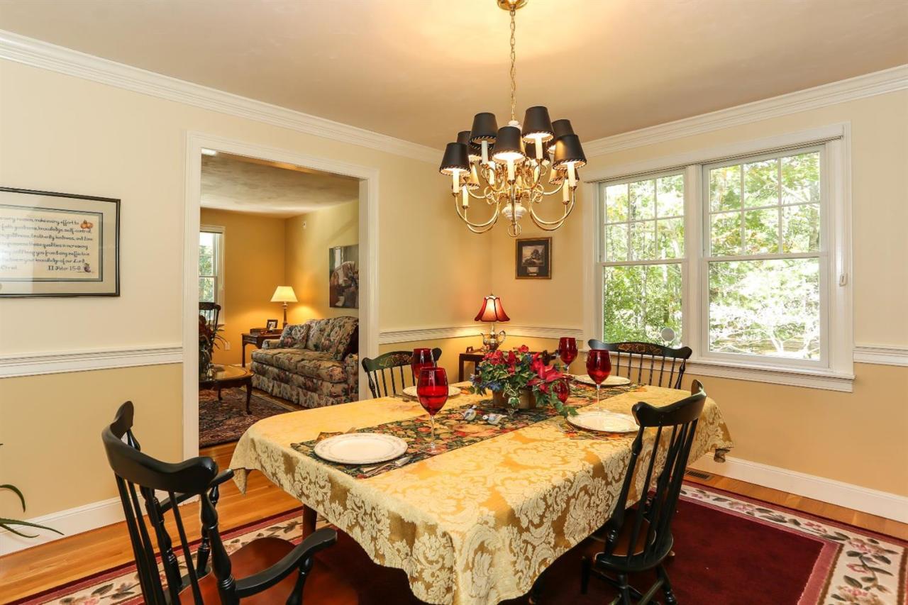 218 Little River Road Cotuit, MA 02635 - Photo 9 of 30 a view of a dining room with furniture window and outside view