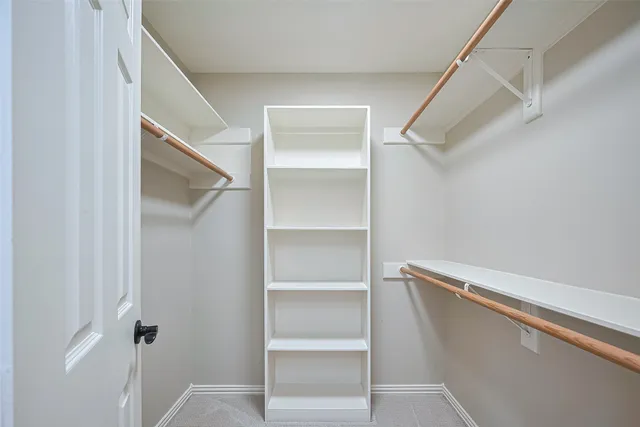 a view of staircase with railing and stairs