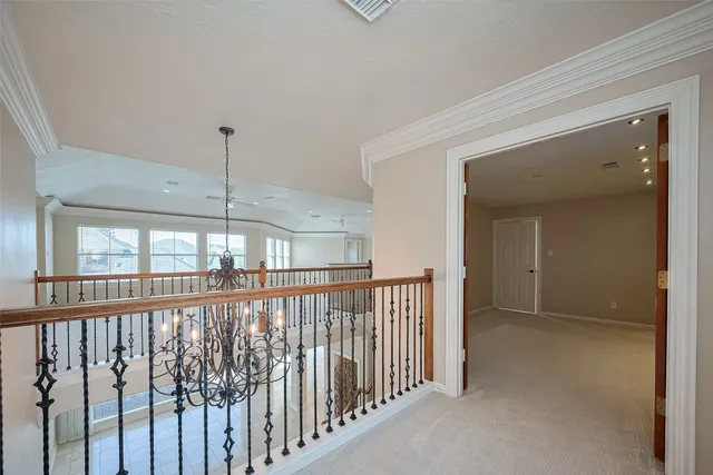 a view of a room with wooden floor and windows