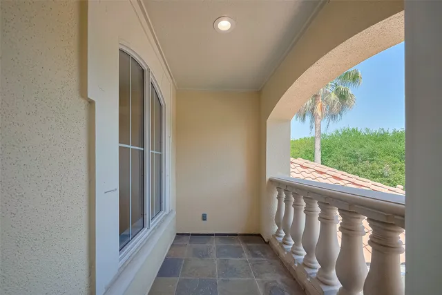 a view of swimming pool in front of residential houses