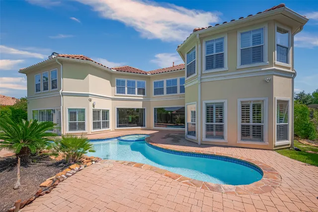 a front view of a house with swimming pool