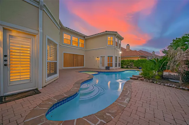 a view of a swimming pool with an outdoor space