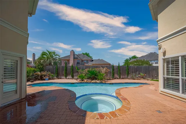 a view of a backyard with sitting area