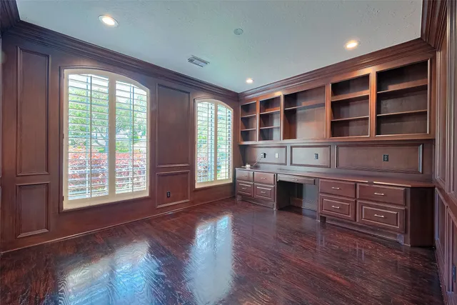 a kitchen with sink cabinets and wooden floor
